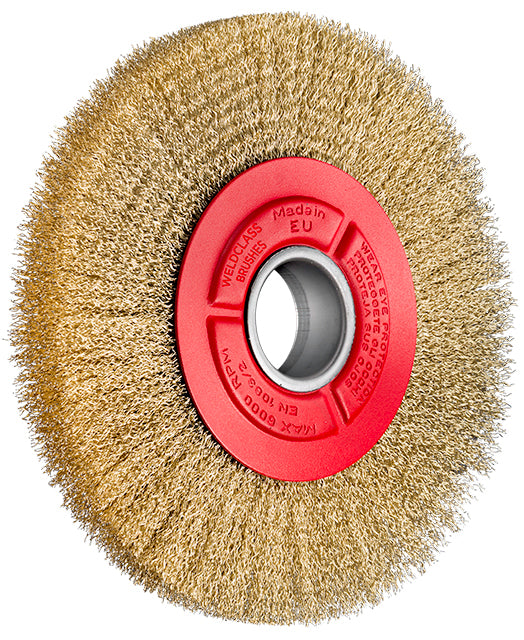 Round metal brush with red center on a white background
